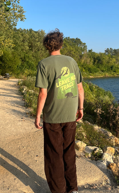 Vistathread Leave No Trace Forest T-shirt model wearing corduroy briwn pants looking away.